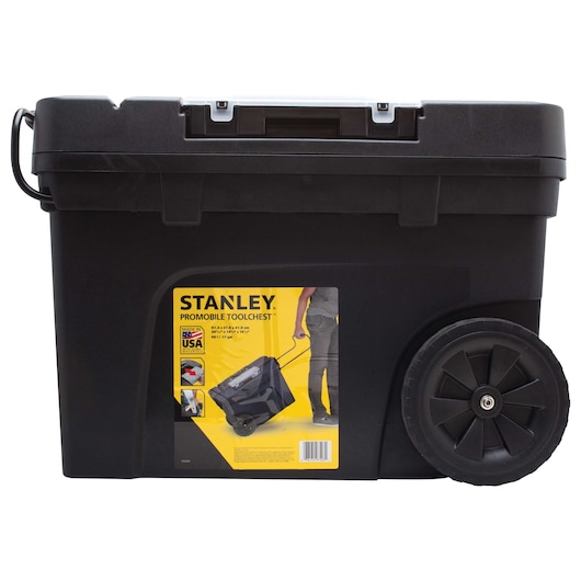 Side angle of black STANLEY mobile tool chest with large wheels and yellow label on white background