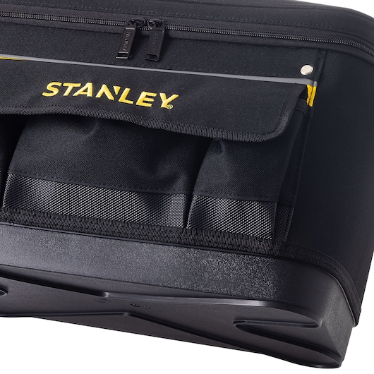 STANLEY 1-96-193 tool bag, black fabric with yellow logo and multiple exterior pockets, angled close-up on white background.