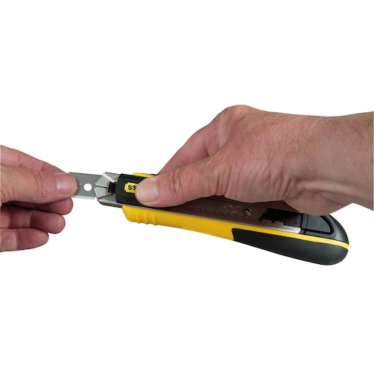 Photo of STANLEY 10-481 utility knife blade replacement with hands holding the knife and blade.