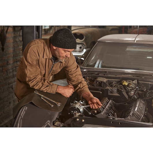 ANTISLIP WRENCH 9/16"STANLEY  MECHANICAL WORKSHOP FRONT MECHANIC ADJUSTING A PART OF THE MOTOR OF A CAR