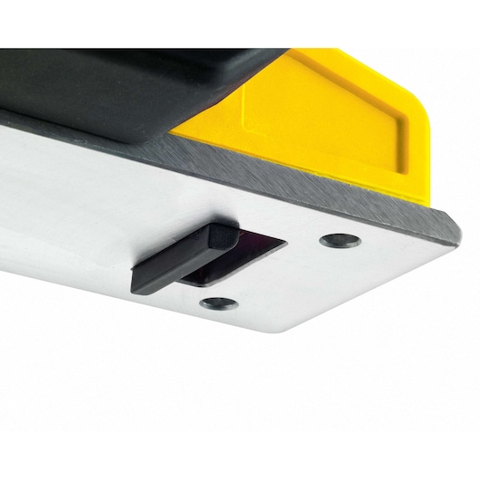 STANLEY STPP7502-B2 electric planer close-up, yellow and black body, metal base with blade, detail view.
