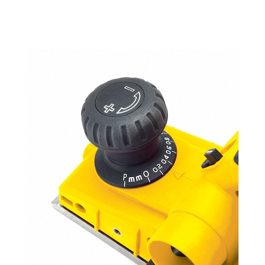 STANLEY STPP7502-B2 photography of yellow planer adjustment knob at close angle, with depth scale markings.